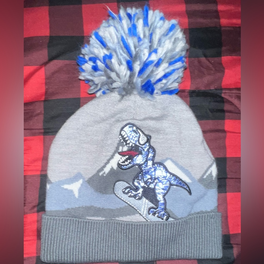 Small children’s dinosaur winter hat